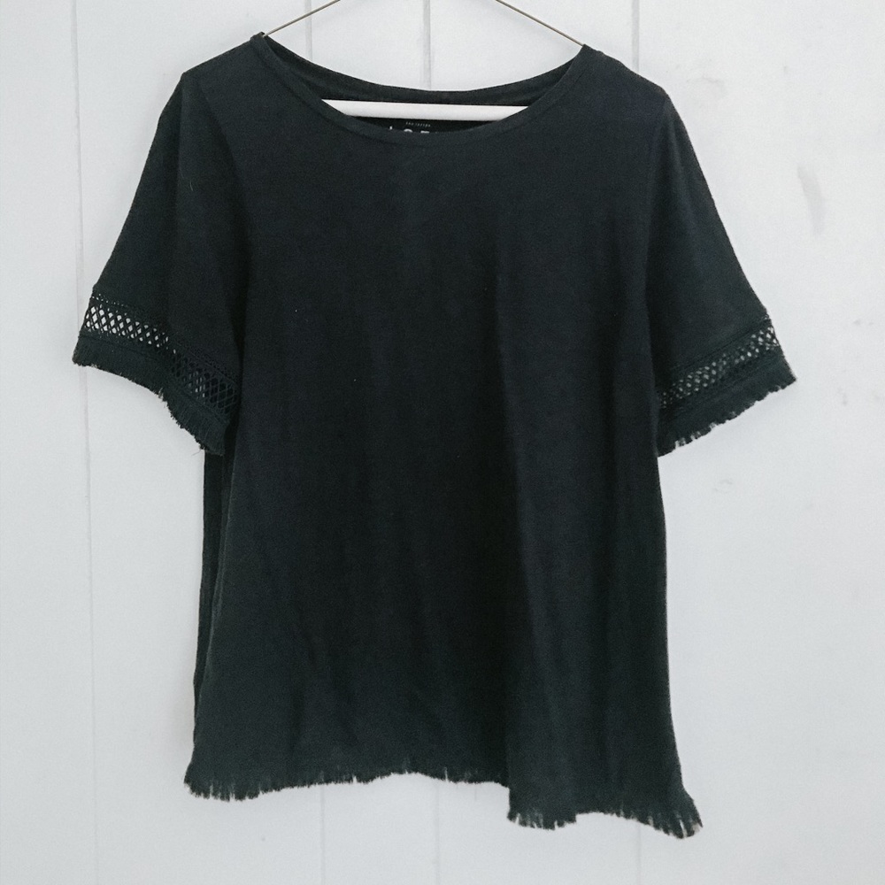 navy top with textured sleeves and bottom.